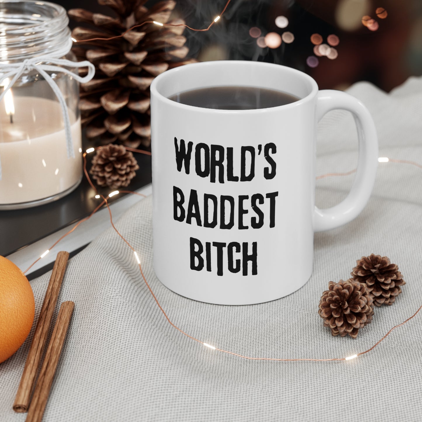 a white coffee mug with the words world's baddest bitch on it