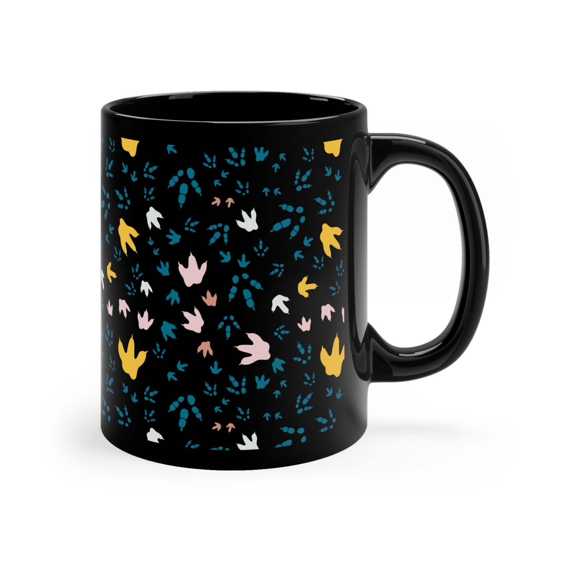 View of mug with handle to the right and multicolored Dinosaur Footprints