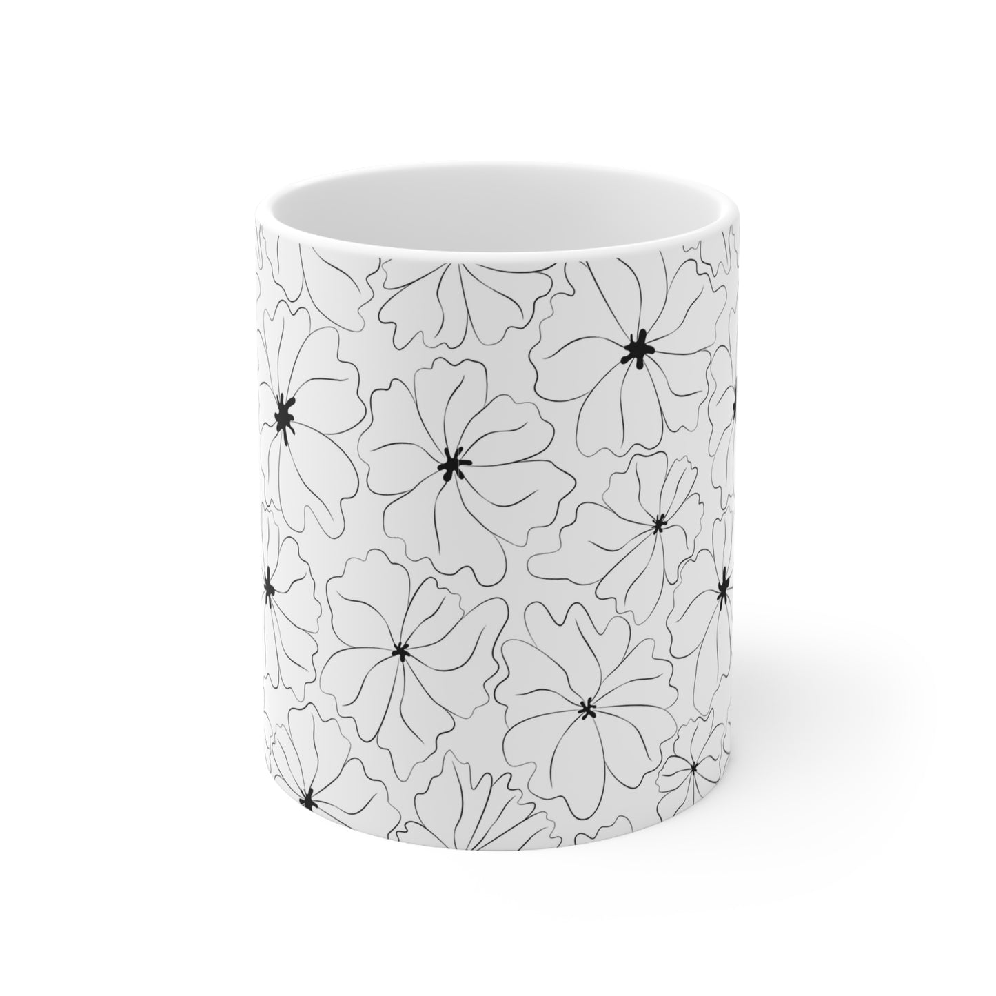 Front view of cup without handle showing a pattern of black and white flowers