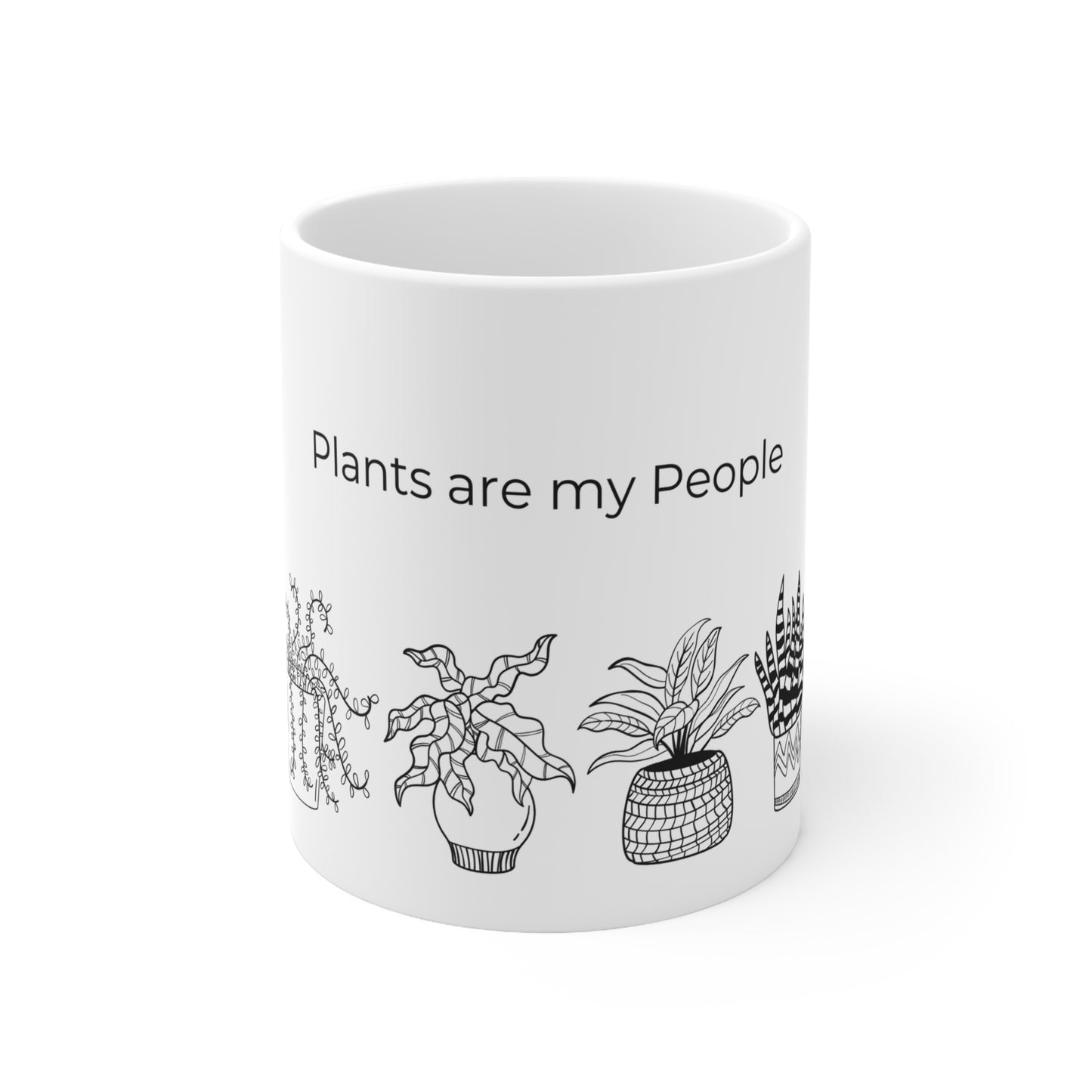 a white coffee mug with plants on it