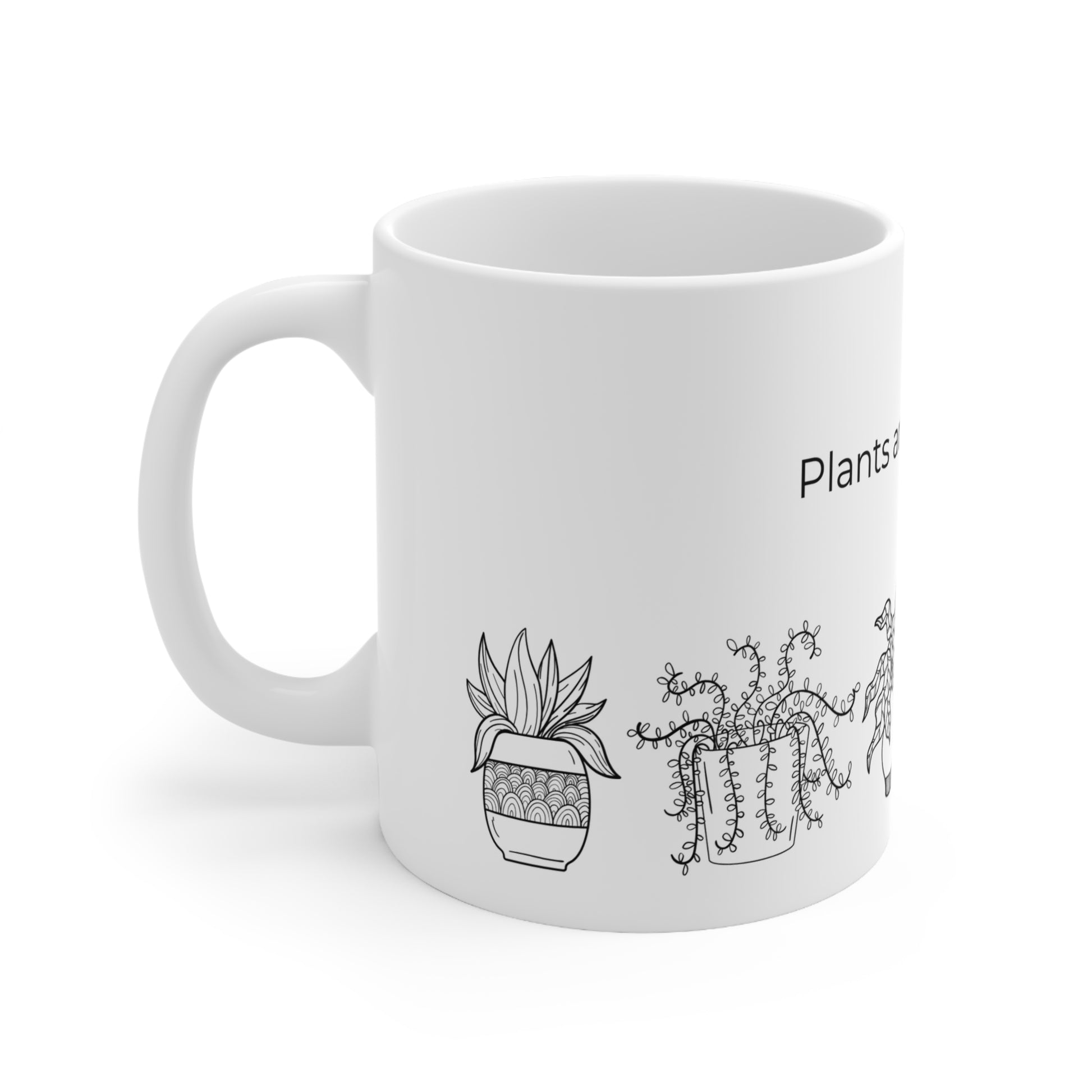 a white coffee mug with plants on it