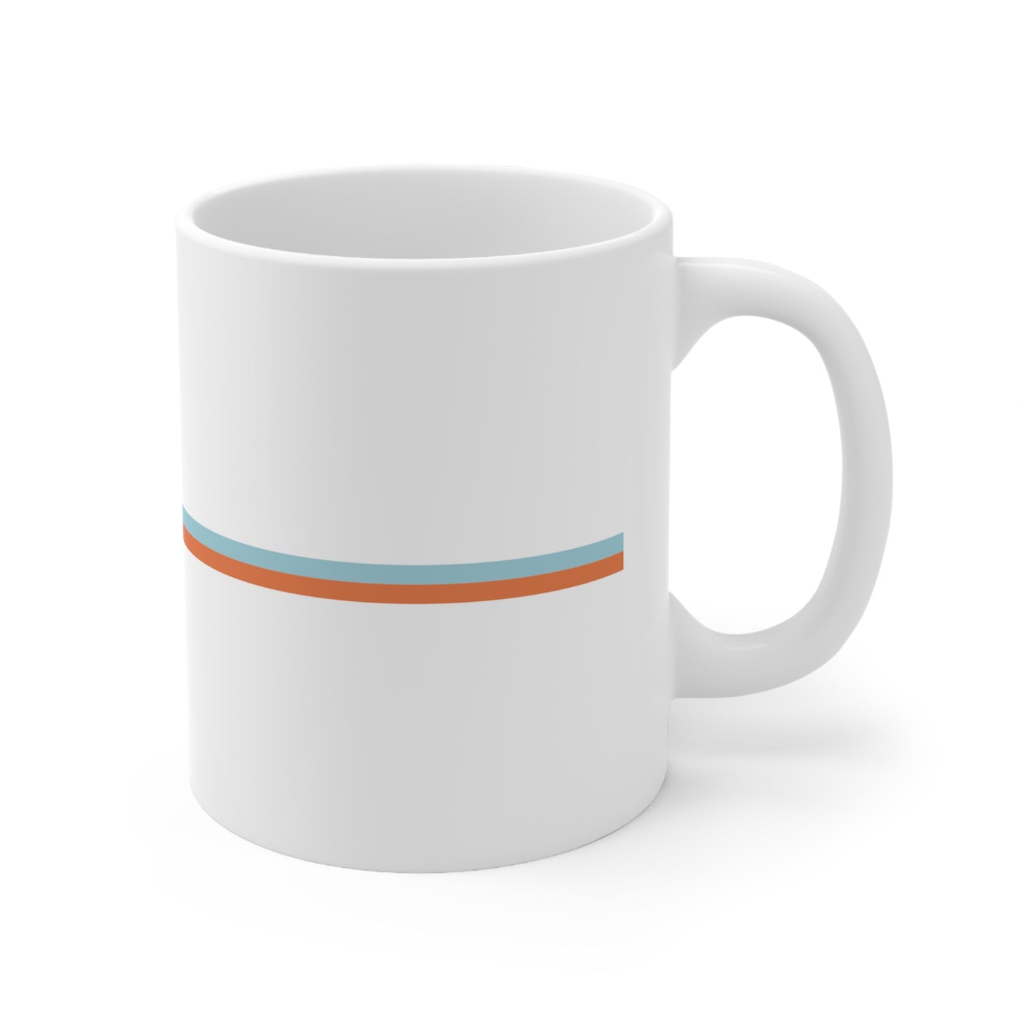 View of mug with handle to the right, only blue and orange lines on this side